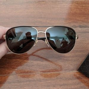 Women's authentic Gucci aviator sunglasses.